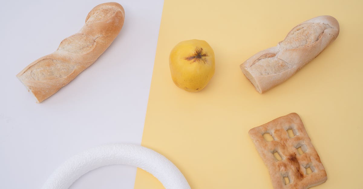 White bread without the "yeasty" or "bready" flavor - Yellow Apple Fruit Beside Bread on White Table White bread without the "yeasty" or "bready" flavor - Yellow Apple Fruit Beside Bread on White Table