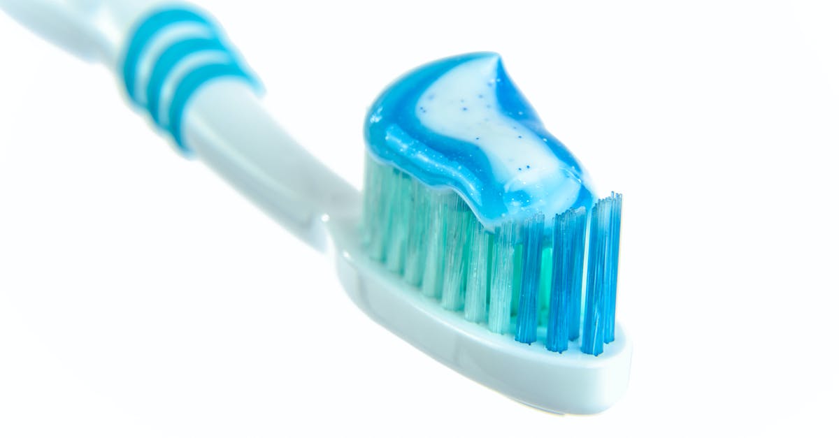 White bristles on carrots - Blue and White Toothpaste on Toothbrush White bristles on carrots - Blue and White Toothpaste on Toothbrush