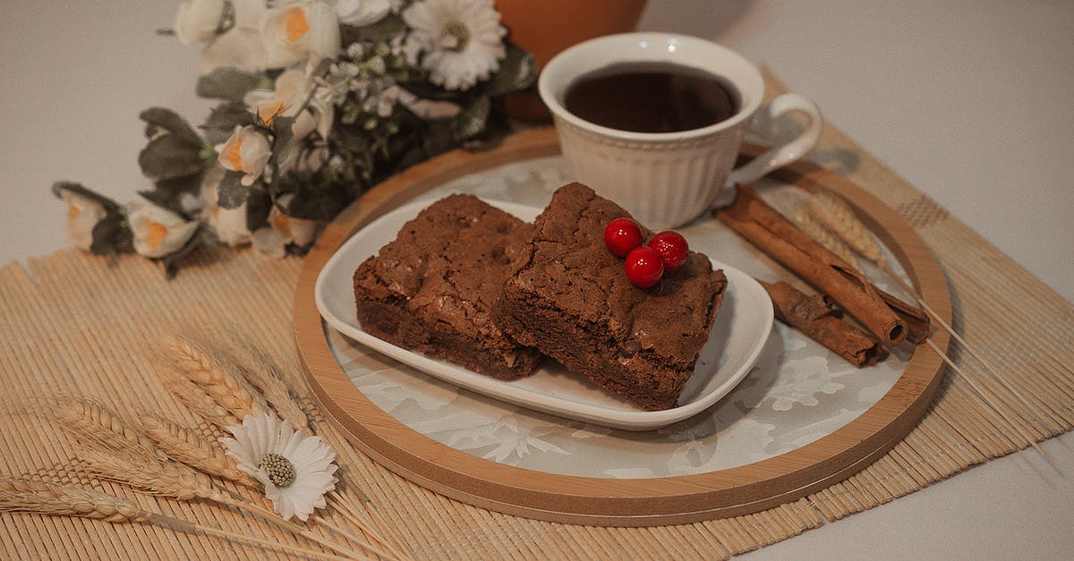 White chocolate mud cake with dark chocolate ganache? - Chocolate Cake on White Ceramic Plate White chocolate mud cake with dark chocolate ganache? - Chocolate Cake on White Ceramic Plate