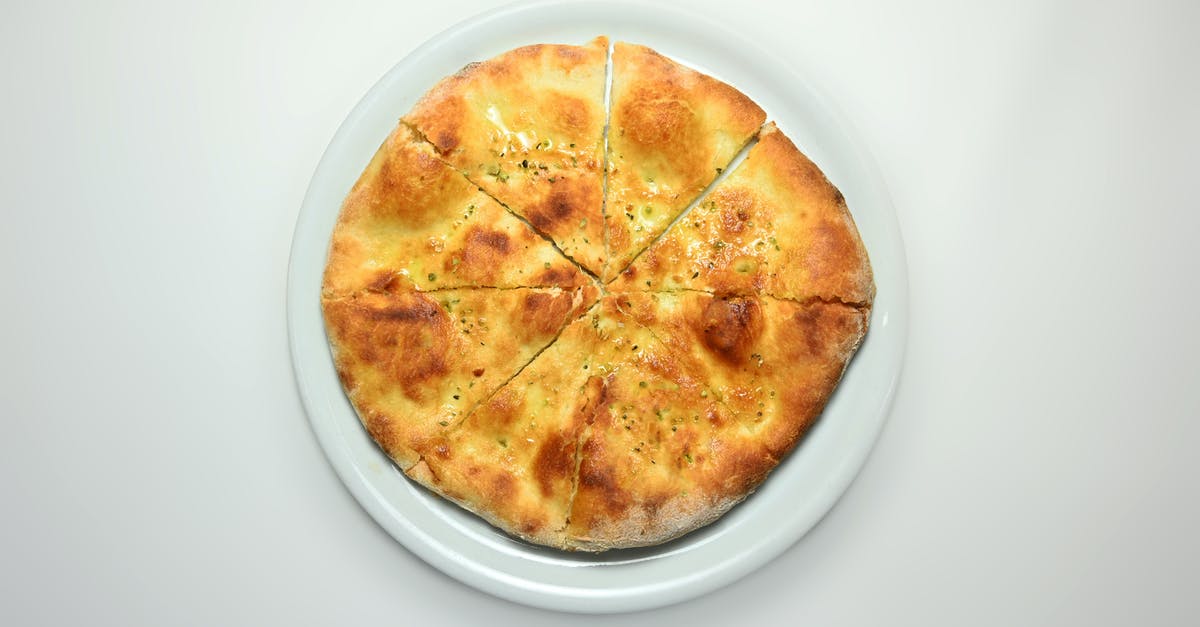 White dots on pizza or focaccia after baking - Pizza bread food isolated background White dots on pizza or focaccia after baking - Pizza bread food isolated background
