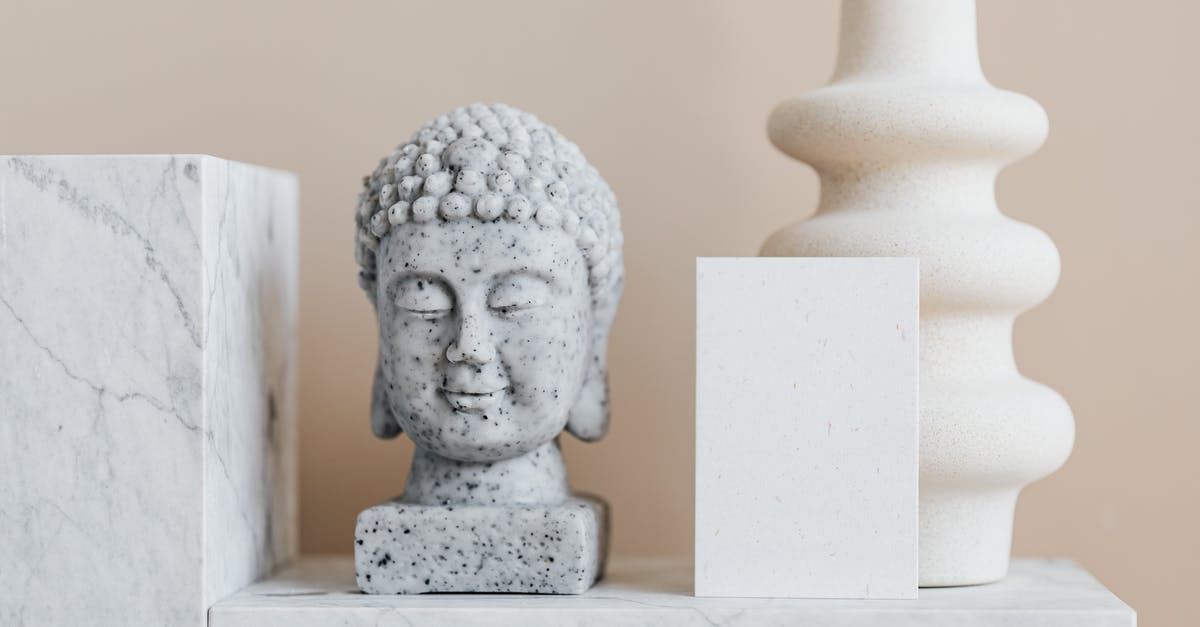 white spots on top of indian pickle - Granite bust of Buddha placed near white ceramic vase of creative geometric shape and blank card on white marble shelf against beige wall white spots on top of indian pickle - Granite bust of Buddha placed near white ceramic vase of creative geometric shape and blank card on white marble shelf against beige wall