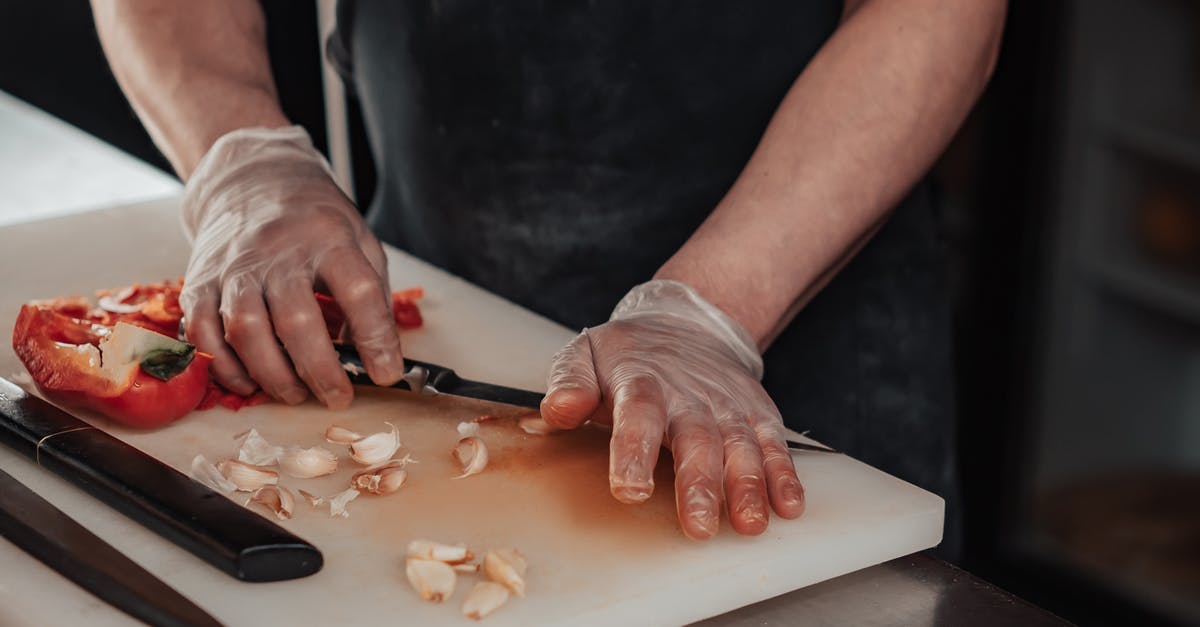 Why are chef's knives wide? - Person Making a Dough on a White Table Why are chef's knives wide? - Person Making a Dough on a White Table