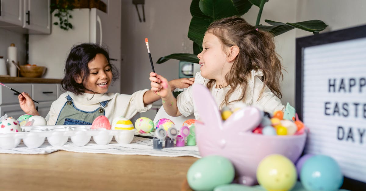 Why are croissants brushed twice with egg glaze? - Smiling little multiracial kids in casual clothes sitting at wooden table and coloring Easter eggs with brushes and forms in light apartment Why are croissants brushed twice with egg glaze? - Smiling little multiracial kids in casual clothes sitting at wooden table and coloring Easter eggs with brushes and forms in light apartment