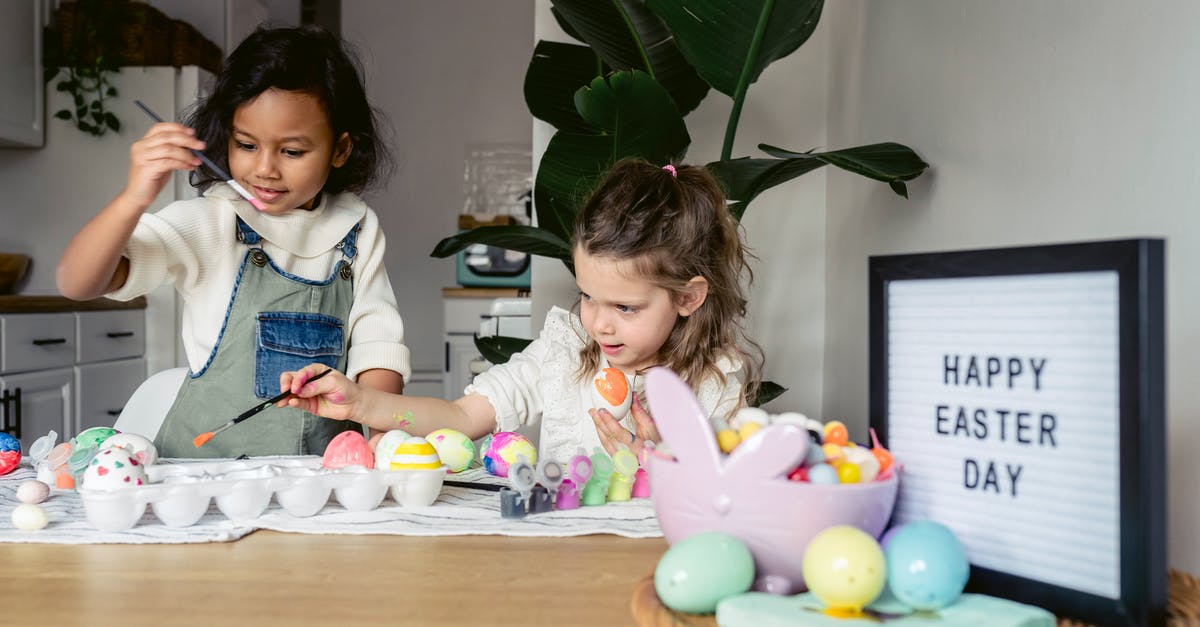 Why are croissants brushed twice with egg glaze? - Concentrated multiracial girls in casual outfits coloring Easter eggs with brushes near wooden table with various decorative objects in bright kitchen Why are croissants brushed twice with egg glaze? - Concentrated multiracial girls in casual outfits coloring Easter eggs with brushes near wooden table with various decorative objects in bright kitchen