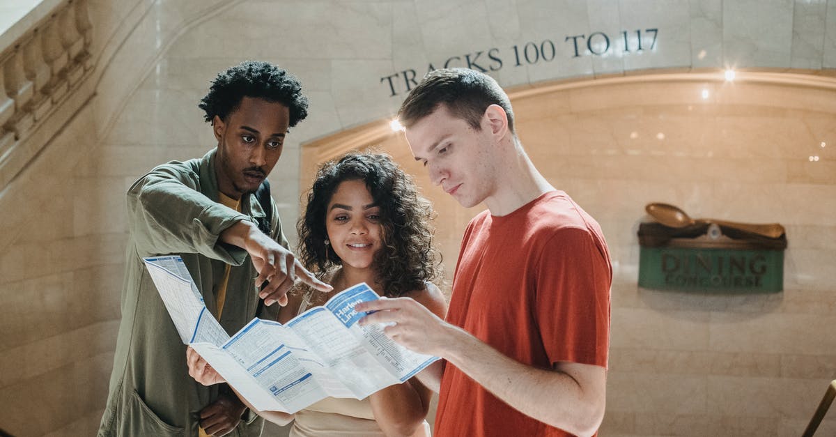 Why are grape preserves so hard to find in the USA? - Young focused diverse students exploring map in railway station Why are grape preserves so hard to find in the USA? - Young focused diverse students exploring map in railway station