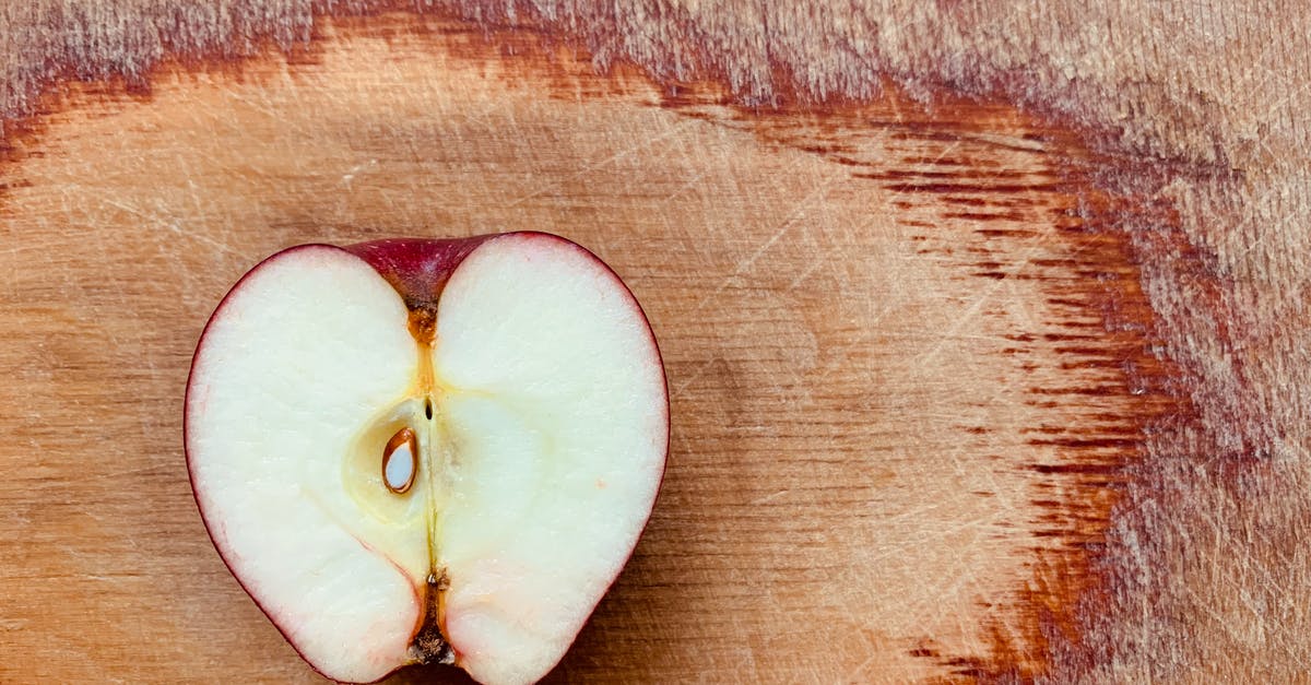 Why are my apple fritters too doughy in the center? - Sliced Apple Fruit on Brown Wooden Surface Why are my apple fritters too doughy in the center? - Sliced Apple Fruit on Brown Wooden Surface