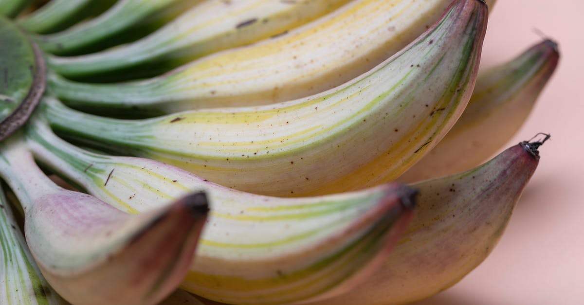 Why are my (italian Whole foods) sausages still pink inside? - Bunch of fresh small bananas with dark spots located on pink surface Why are my (italian Whole foods) sausages still pink inside? - Bunch of fresh small bananas with dark spots located on pink surface