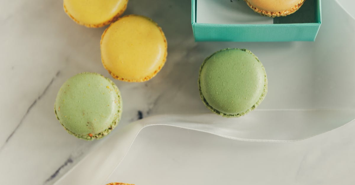 Why are my macarons cracking on top? - Pink Macarons in Clear Glass Jars Why are my macarons cracking on top? - Pink Macarons in Clear Glass Jars