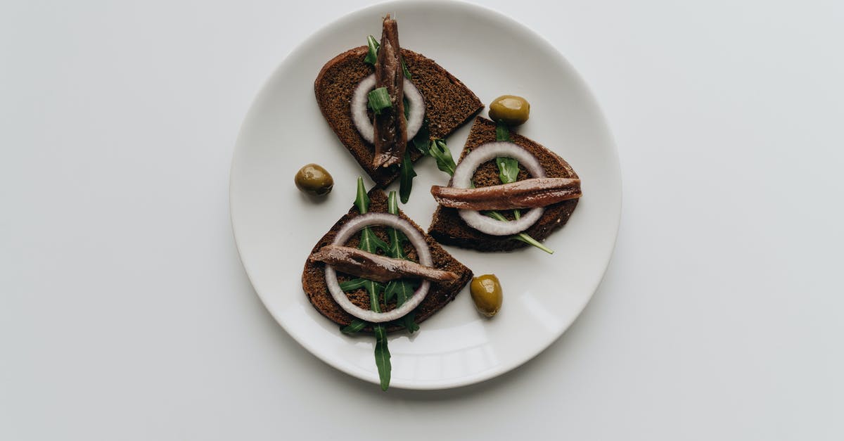Why are my olives discolouring in their brine? - Brown and Green Vegetable on White Ceramic Plate Why are my olives discolouring in their brine? - Brown and Green Vegetable on White Ceramic Plate