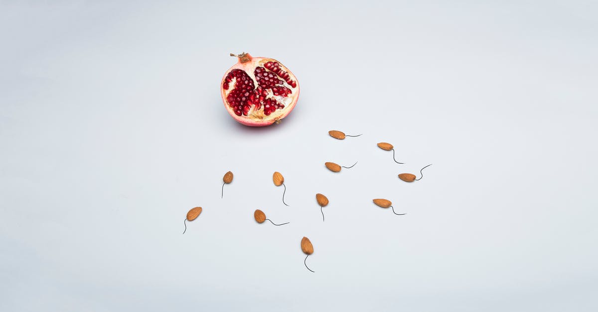 Why are my pomegranate seeds white? - Red and Black Fruit on White Surface Why are my pomegranate seeds white? - Red and Black Fruit on White Surface