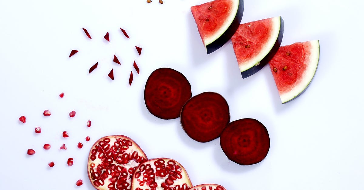Why are my pomegranate seeds white? - Slices of Red Fresh Fruits on a White Surface Why are my pomegranate seeds white? - Slices of Red Fresh Fruits on a White Surface