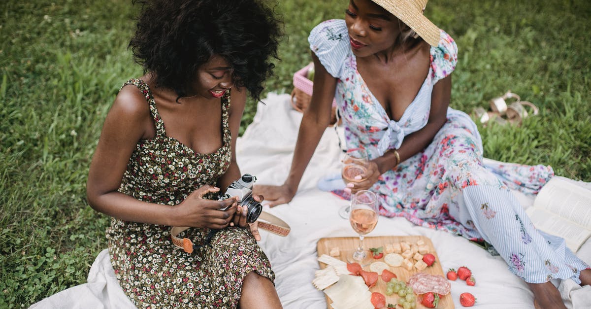 Why are my strawberries keeping so long? - Woman in Black and White Floral Dress Sitting on White Textile Why are my strawberries keeping so long? - Woman in Black and White Floral Dress Sitting on White Textile