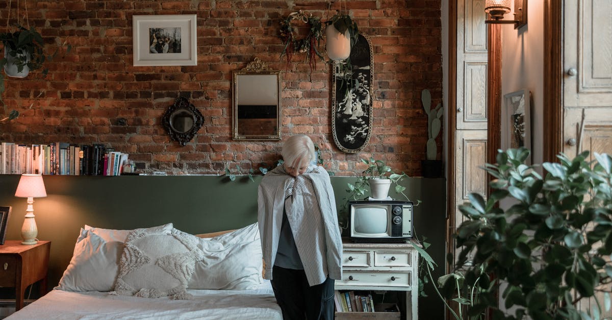 Why are roasts wrapped in foil? - Woman in Gray Long Sleeve Shirt Standing Near Bed Why are roasts wrapped in foil? - Woman in Gray Long Sleeve Shirt Standing Near Bed