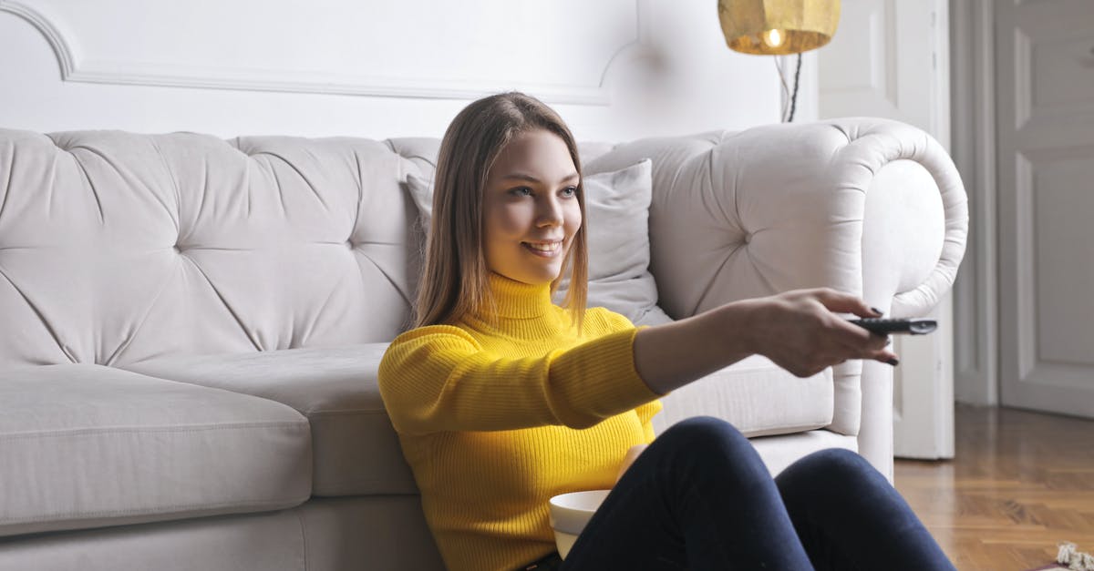 Why are some foods preferentially eaten at certain times of day? - Joyful millennial female in casual clothes with bowl of snack using remote controller while sitting on floor leaning on sofa and watching movie in cozy light living room with luxury interior Why are some foods preferentially eaten at certain times of day? - Joyful millennial female in casual clothes with bowl of snack using remote controller while sitting on floor leaning on sofa and watching movie in cozy light living room with luxury interior
