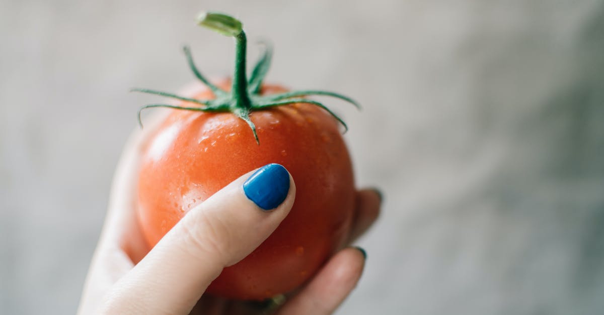 Why are the stems left on when cooking an artichoke? - Person Holding Red Tomato Why are the stems left on when cooking an artichoke? - Person Holding Red Tomato