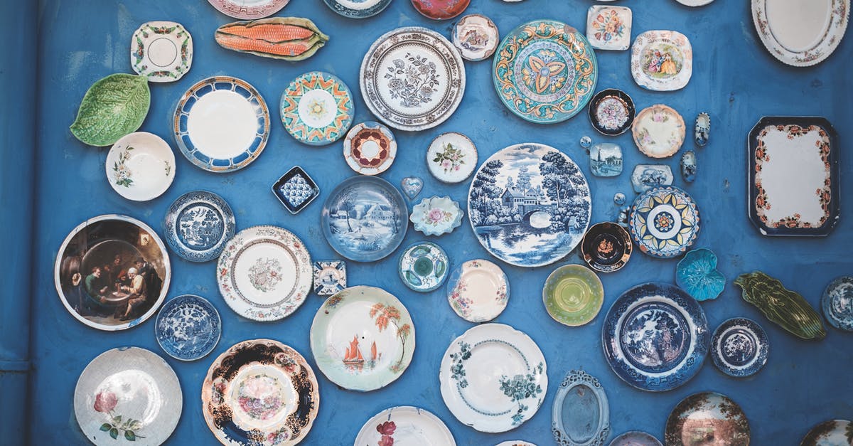 Why are there so many different pasta shapes? - Composition of various decorative ornamental plates of different sizes and colors arranged on blue wall Why are there so many different pasta shapes? - Composition of various decorative ornamental plates of different sizes and colors arranged on blue wall