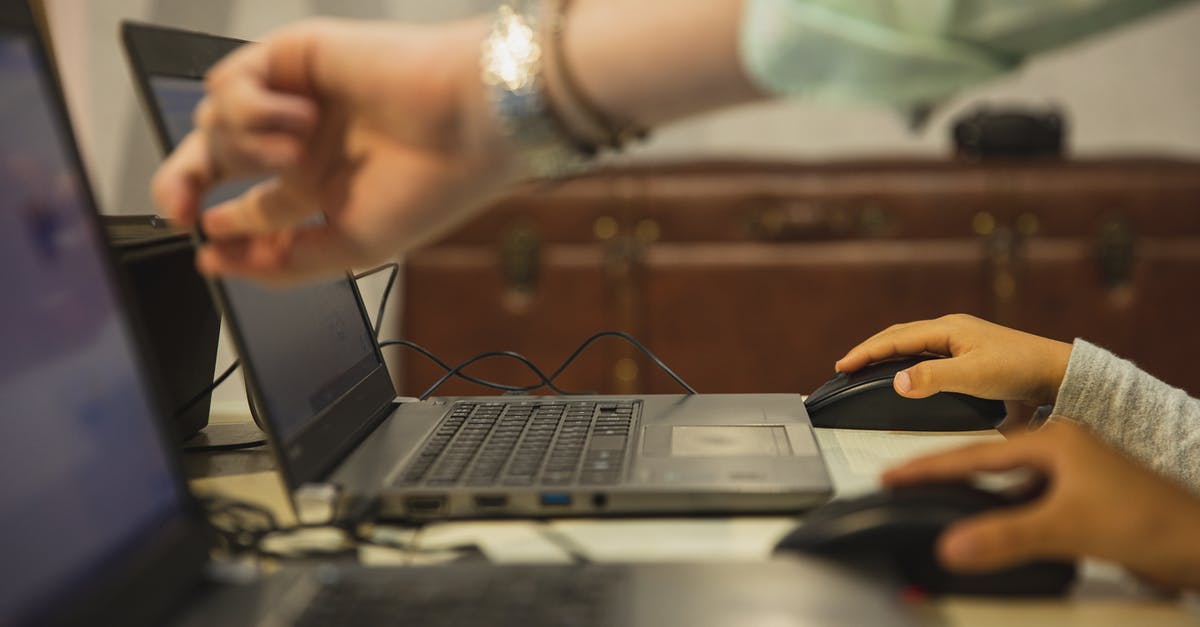 Why are wire beaters becoming more common in hand mixers? - Crop anonymous female teacher pointing at netbook screen near schoolchildren touching mouses at desk in classroom Why are wire beaters becoming more common in hand mixers? - Crop anonymous female teacher pointing at netbook screen near schoolchildren touching mouses at desk in classroom