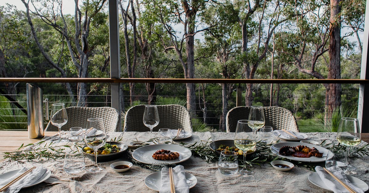 Why boil octopus with wine cork? - Table served for guests on terrace Why boil octopus with wine cork? - Table served for guests on terrace
