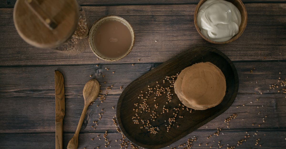 Why Buckwheat Pancakes? - Buckwheat pancakes on wooden table Why Buckwheat Pancakes? - Buckwheat pancakes on wooden table