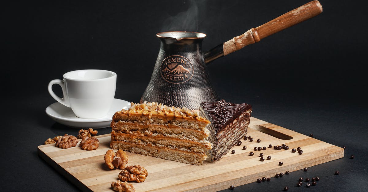 Why can't chocolate be made caffeine free? - Photo Of Cake Near Mug Why can't chocolate be made caffeine free? - Photo Of Cake Near Mug