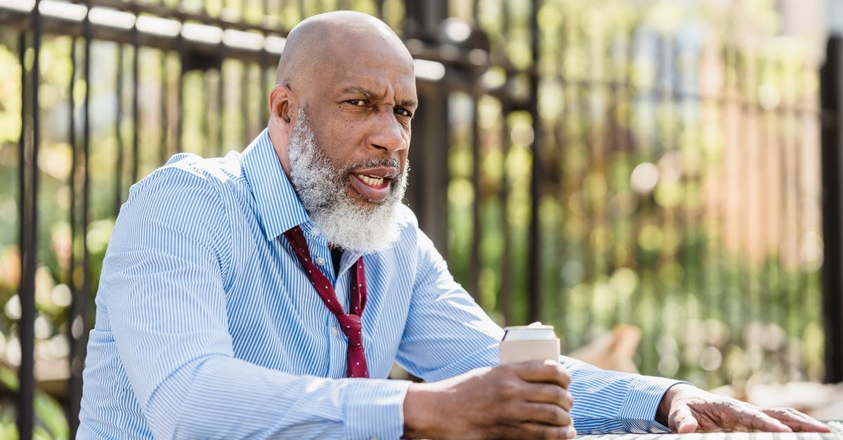Why can I cook well but not identify flavours? [duplicate] - Sullen black man sitting at table with drink