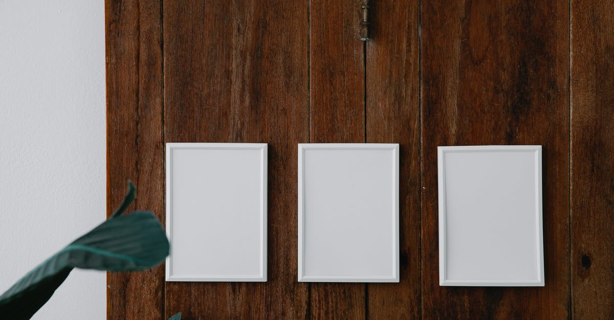 Why can only white fish be already gutted on board the ship? - Empty white photo frames on wooden surface