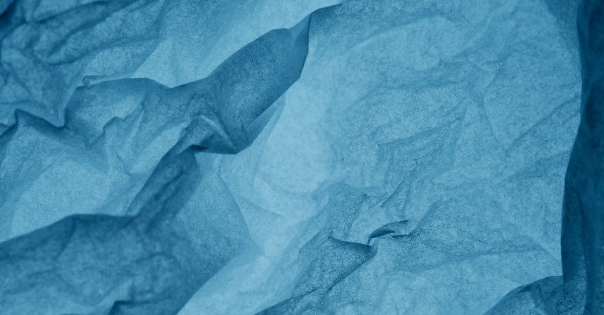 Why did I get wrinkled bagels? - Blue Textile on Brown Wooden Table Why did I get wrinkled bagels? - Blue Textile on Brown Wooden Table