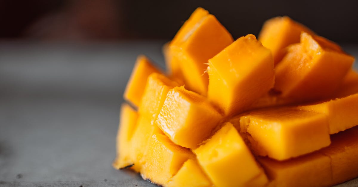 Why did mango lose sweetness after pureeing - A Sliced Mango Cubes on Gray Surface Why did mango lose sweetness after pureeing - A Sliced Mango Cubes on Gray Surface