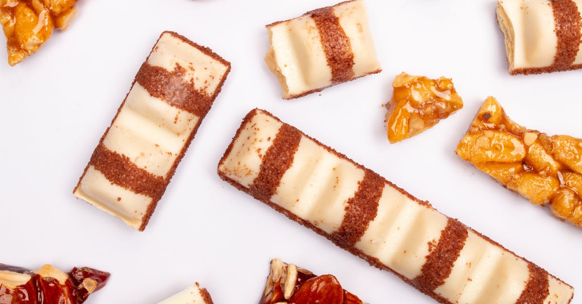 Why did my almonds burn instead of caramelizing? - Kinder Finger and Nuts on White Surface Why did my almonds burn instead of caramelizing? - Kinder Finger and Nuts on White Surface