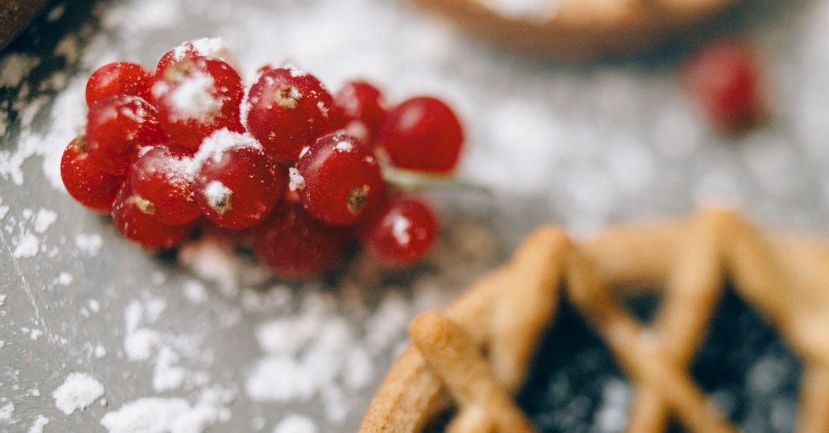 Why did my fruit tart cream/custard have spots in it? - Red Round Fruits on Brown Wooden Table Why did my fruit tart cream/custard have spots in it? - Red Round Fruits on Brown Wooden Table
