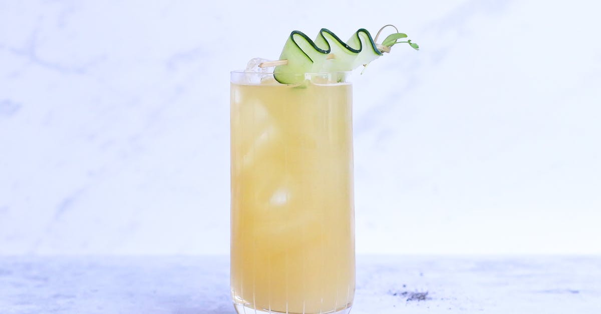 Why did my ginger simple syrup develop such a disgusting consistency? - Glass of yummy sour ginger lemonade garnished with cucumber slice and served on light marble table in studio Why did my ginger simple syrup develop such a disgusting consistency? - Glass of yummy sour ginger lemonade garnished with cucumber slice and served on light marble table in studio