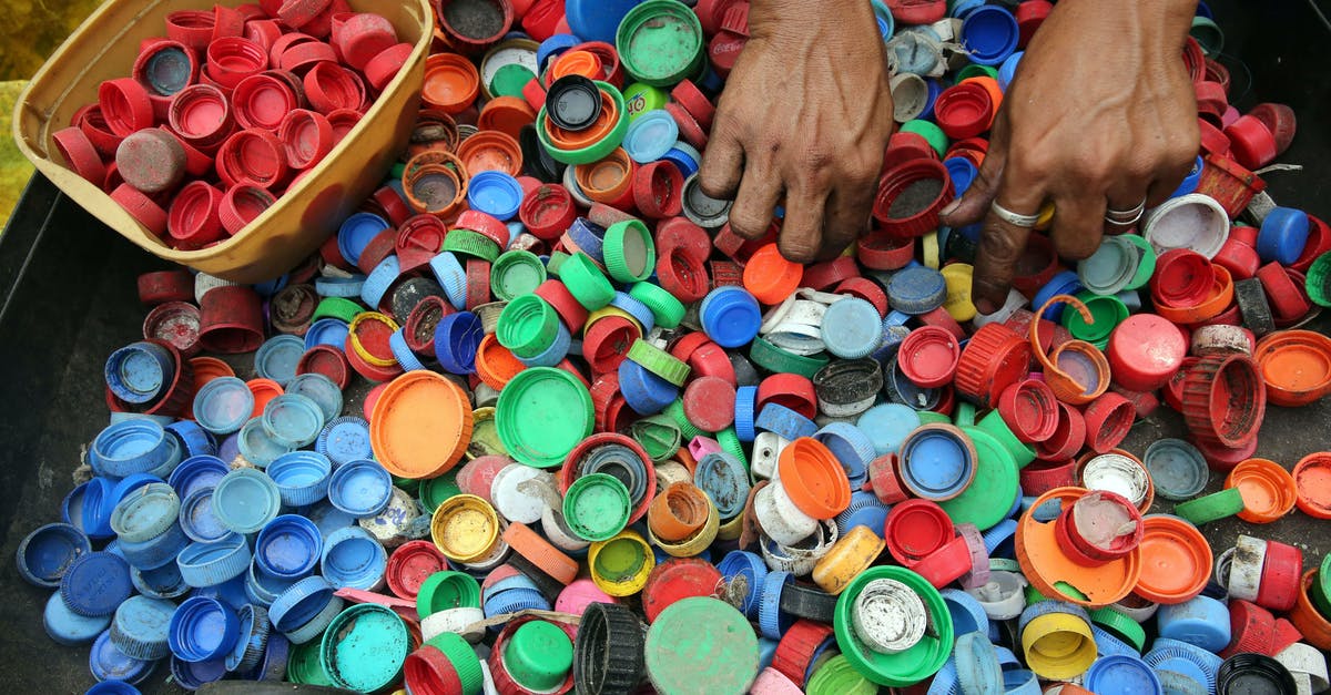 Why did my lids seal? - Person Hands on Assorted-color Plastic Lid Lot Why did my lids seal? - Person Hands on Assorted-color Plastic Lid Lot