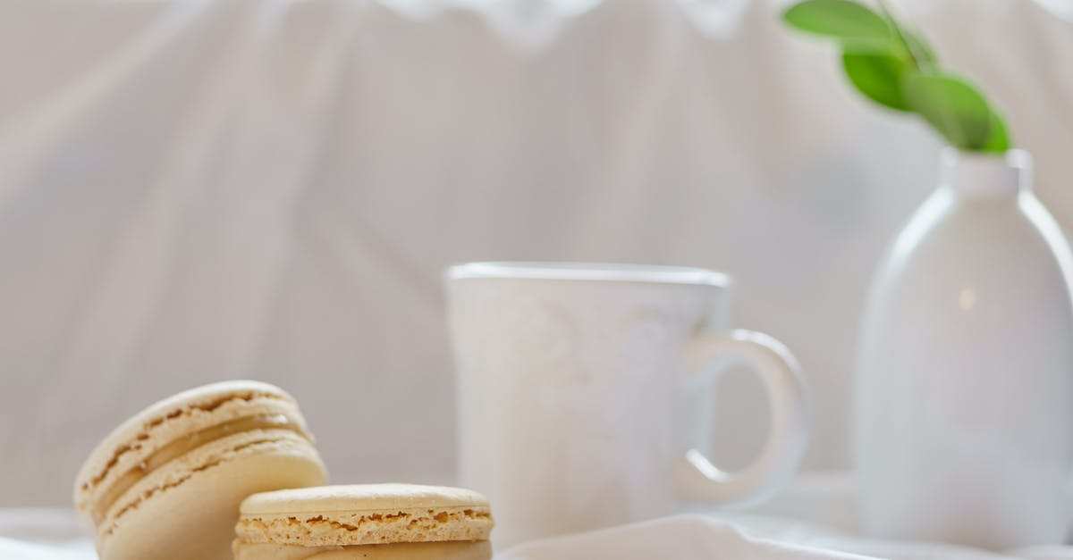 Why did my meringue deflate and go soft? - Delicious macaroons near mug and vase with green plant Why did my meringue deflate and go soft? - Delicious macaroons near mug and vase with green plant