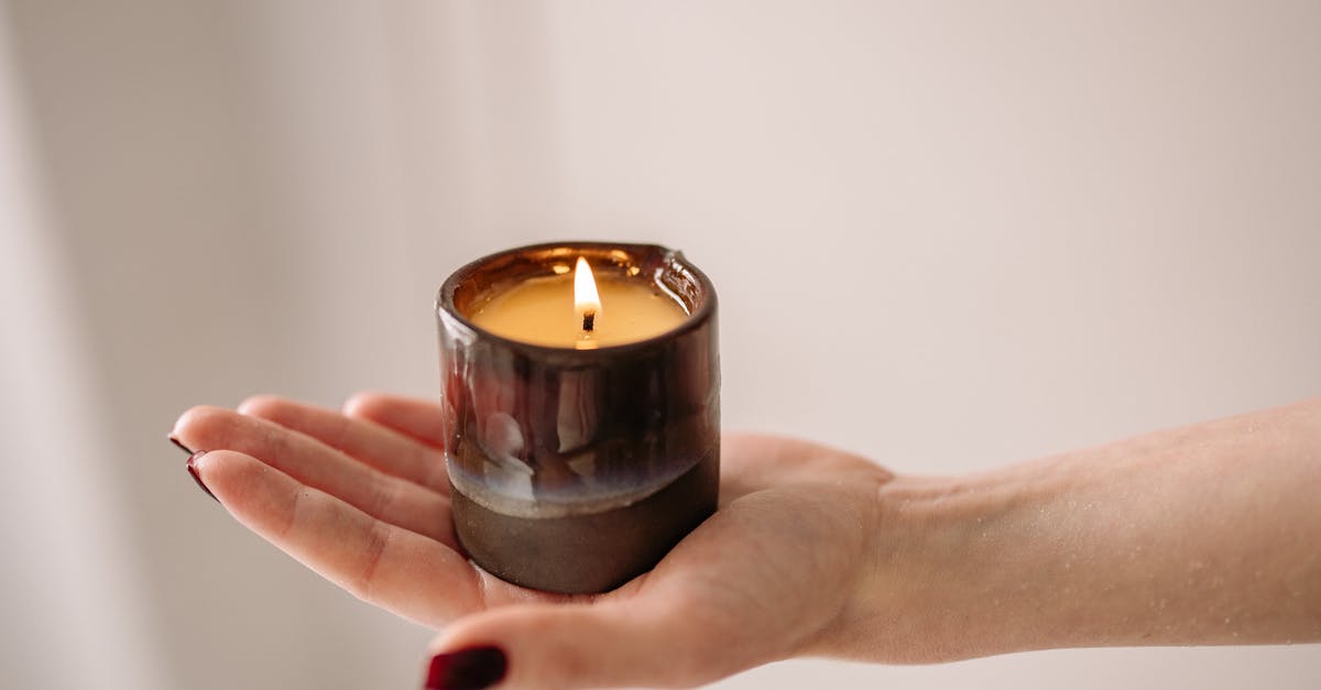 Why did my nougat burn? - Person Holding Black Candle Holder