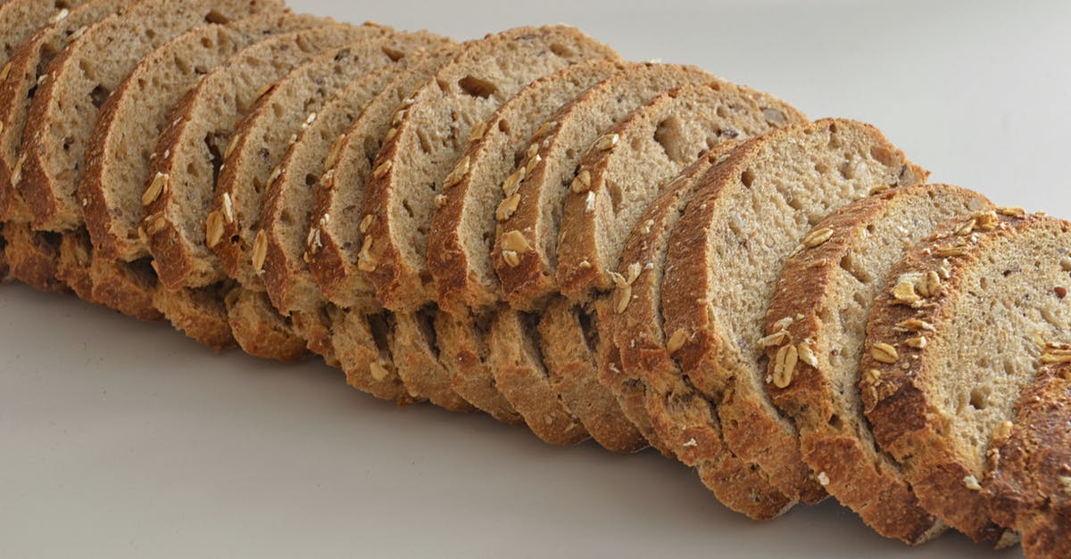 Why didn't my 100% whole wheat bread proof? - Sliced on Bread on White Surfcae Why didn't my 100% whole wheat bread proof? - Sliced on Bread on White Surfcae