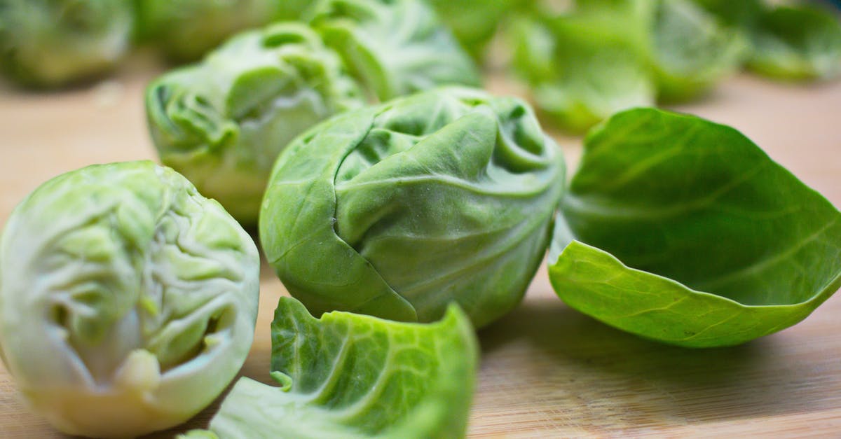 Why do Brussels sprouts only taste good when cut? - Closeup of ripe fresh Brussels sprouts with peels placed on wooden cutting board Why do Brussels sprouts only taste good when cut? - Closeup of ripe fresh Brussels sprouts with peels placed on wooden cutting board