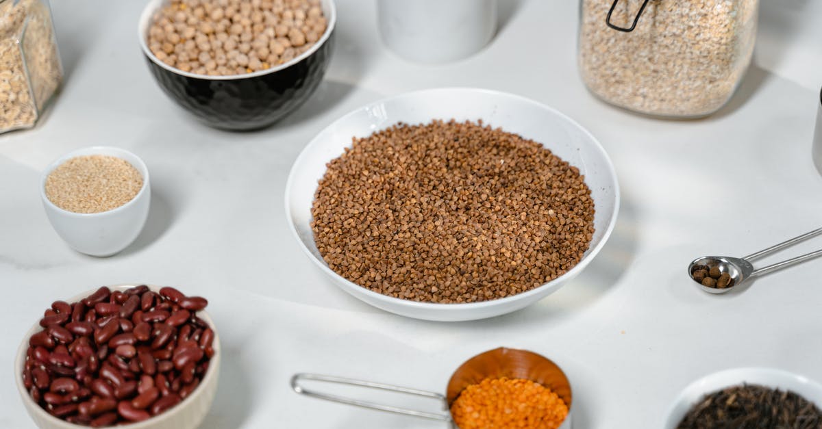 Why do canned beans have less FODMAPs than dried beans? - Brown and White Ceramic Bowls on White Table Why do canned beans have less FODMAPs than dried beans? - Brown and White Ceramic Bowls on White Table