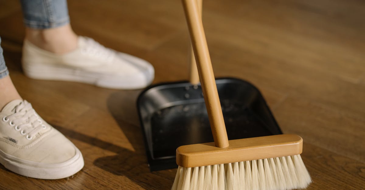 Why do chefs insist that cleanliness is next to godliness? - Person Wearing White Pants and White Socks Standing Beside Brown Broom