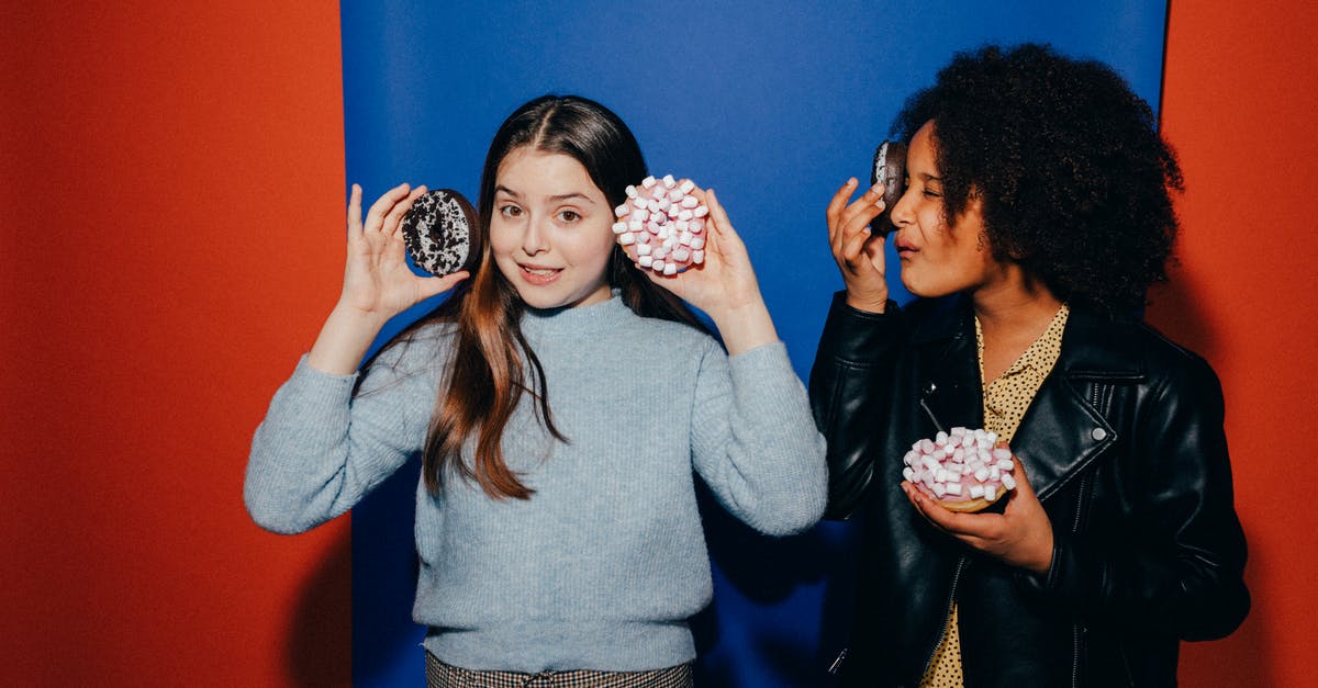 Why do doughnuts have holes? - Girls Holding Doughnuts