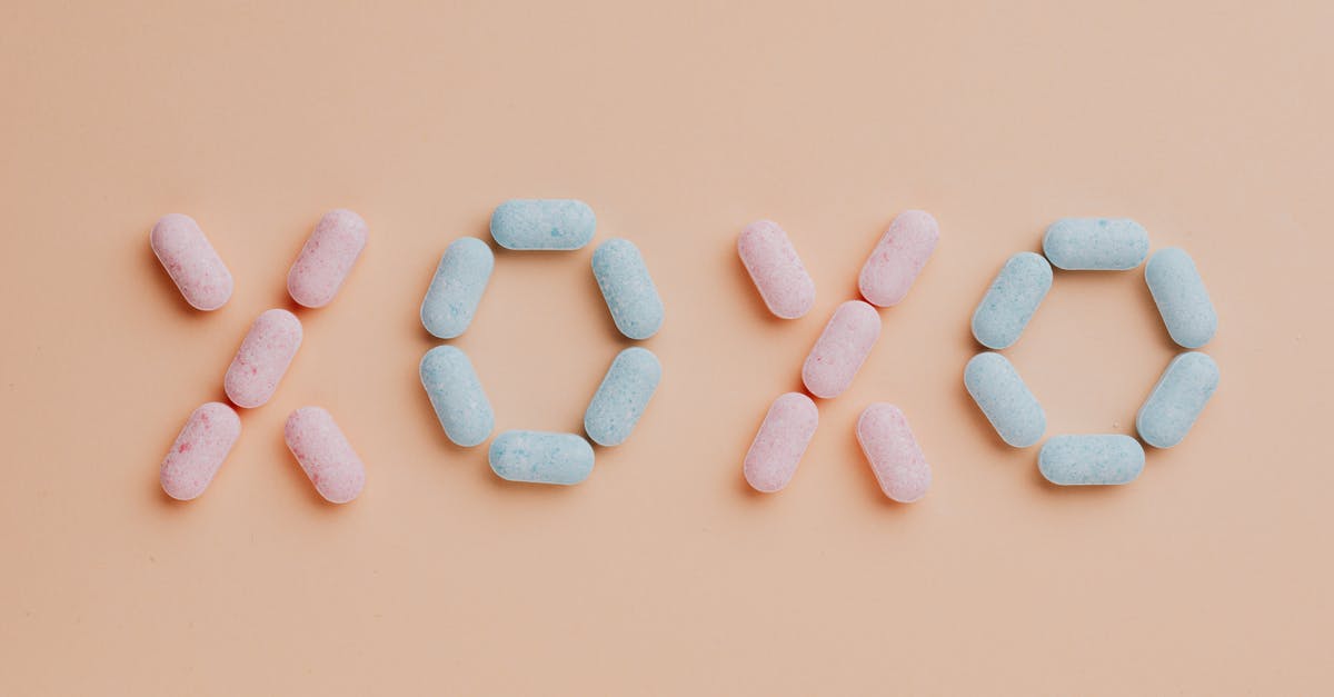Why do grape-flavored foods taste different than actual grapes? - Colorful candy dots on pink background Why do grape-flavored foods taste different than actual grapes? - Colorful candy dots on pink background