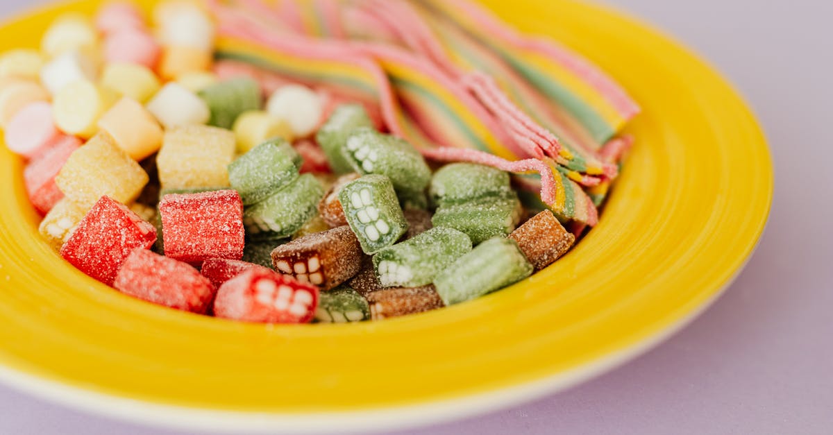 Why do grape-flavored foods taste different than actual grapes? - Tasty colorful gumdrops in plate Why do grape-flavored foods taste different than actual grapes? - Tasty colorful gumdrops in plate