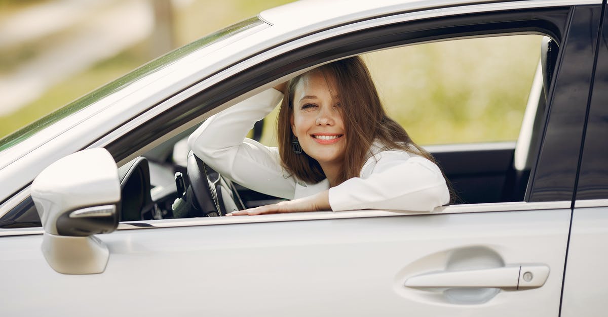 Why do hand held can openers stop working so quickly? - Cheerful female driver in white shirt sitting inside modern automobile and looking at camera through opened side window with smile during car trip in summer day Why do hand held can openers stop working so quickly? - Cheerful female driver in white shirt sitting inside modern automobile and looking at camera through opened side window with smile during car trip in summer day