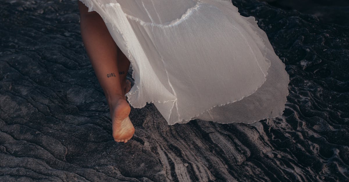 Why do HK chefs let water faucets run unceasingly, when the basin overflows? - Woman Wearing White Dress Walking on Sand