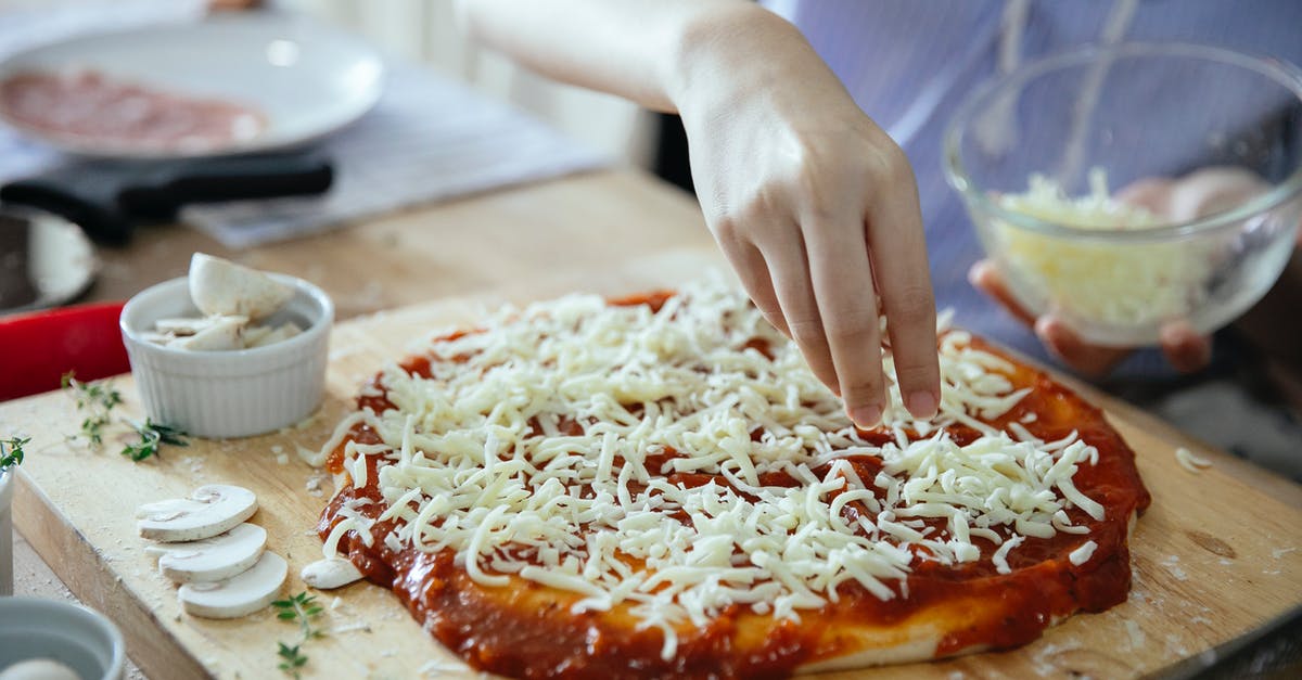 Why do I need to put sablé dough in the fridge? - From above of crop anonymous female adding cheese from bowl on uncooked yummy pizza with tomato sauce on wooden table in kitchen Why do I need to put sablé dough in the fridge? - From above of crop anonymous female adding cheese from bowl on uncooked yummy pizza with tomato sauce on wooden table in kitchen