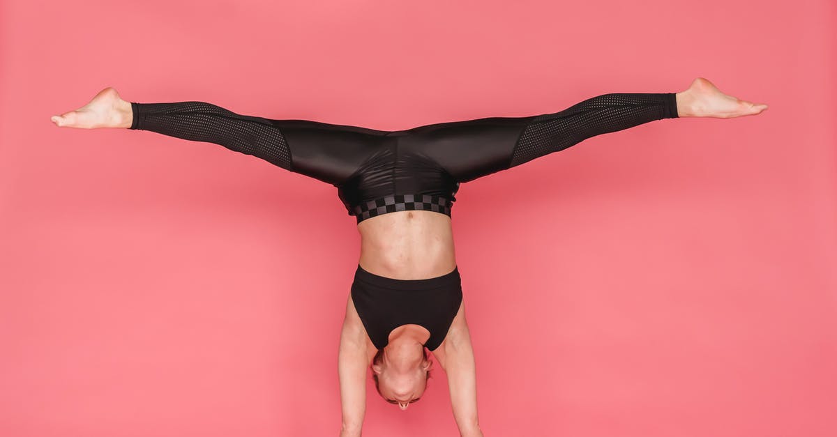 Why do my hotpockets always split down the sides? - Flexible woman stretching legs while standing on hands