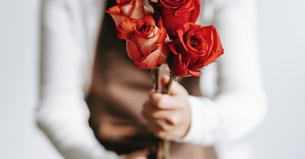 Why do my stored cashews smell like fish? - Woman with branches of roses in hands Why do my stored cashews smell like fish? - Woman with branches of roses in hands
