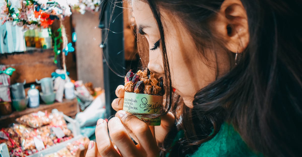Why do my stored cashews smell like fish? - Woman Holding Brown Labeled Pack Why do my stored cashews smell like fish? - Woman Holding Brown Labeled Pack