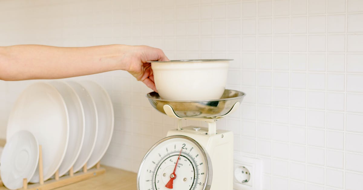 Why do my weighing scales have ml and g? - A Person Weighing the Ingredients on the Bowl Why do my weighing scales have ml and g? - A Person Weighing the Ingredients on the Bowl