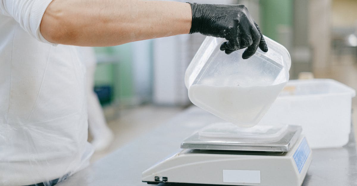 Why do my weighing scales have ml and g? - Person Pouring an Ingredient from a Plastic Container to a Weighing Scale Why do my weighing scales have ml and g? - Person Pouring an Ingredient from a Plastic Container to a Weighing Scale