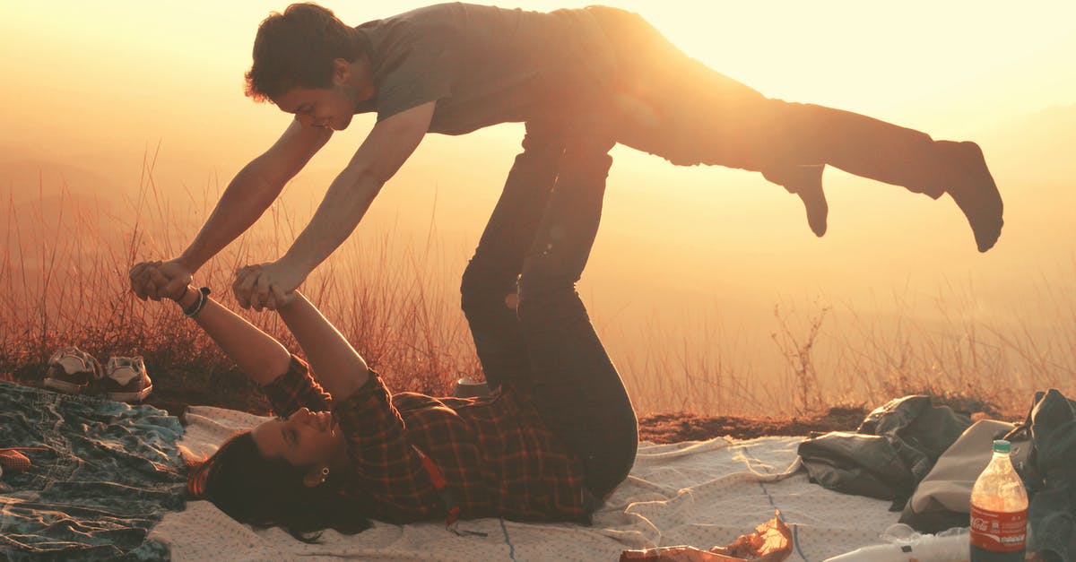 Why do people put Coke on their ham? - Woman Lying on Blanket Under Man on Her Legs Holding Hands during Golden Hour Why do people put Coke on their ham? - Woman Lying on Blanket Under Man on Her Legs Holding Hands during Golden Hour
